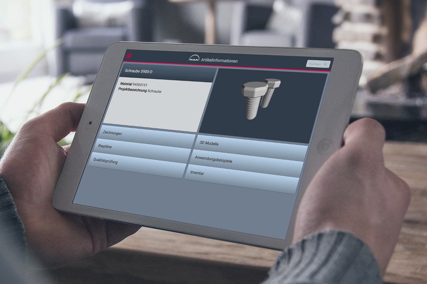 Auf einem iPad werden in der MAN Paperless Prototyp App Informationen zu einer Schraube angezeigt